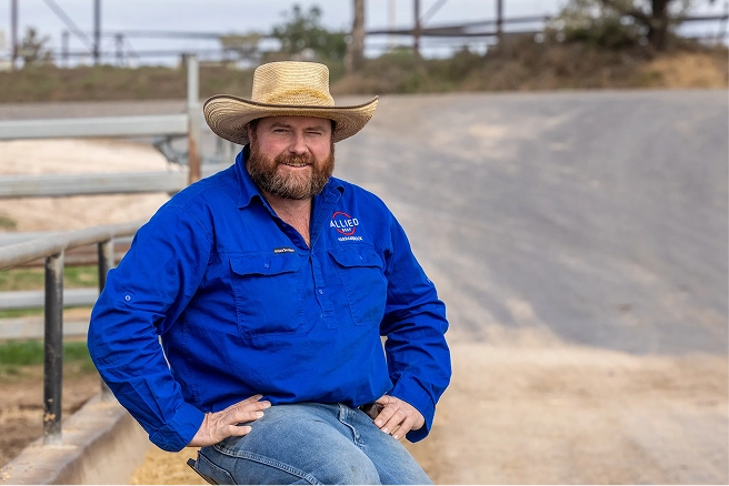 Portrait of an Allied Beef stockman in a blue work shirt at the feedlot